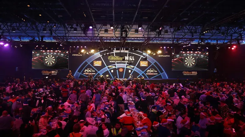 A PDC stage with the Winmau Blade dartboard on the big screens